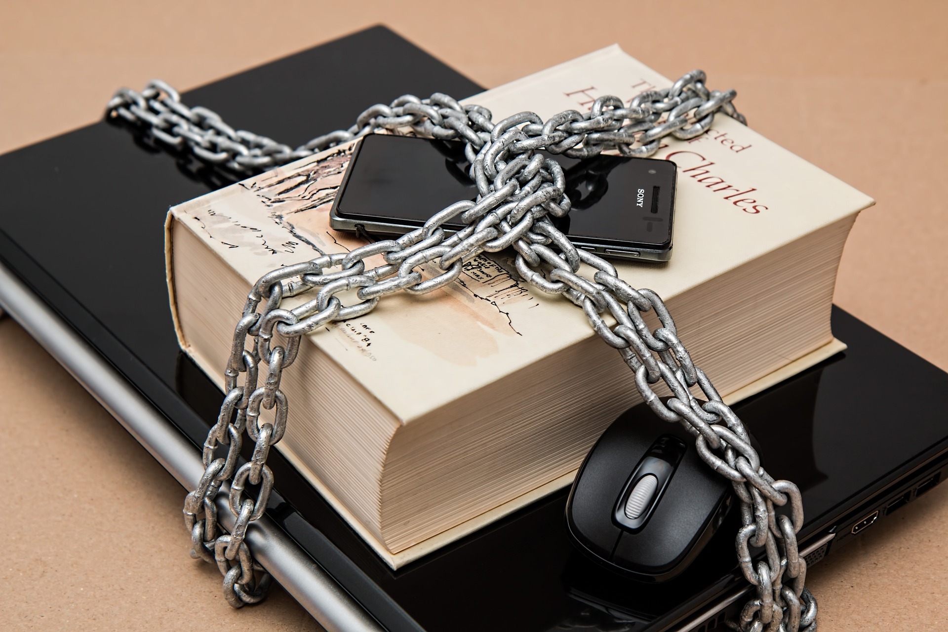 different methods of authentication such as mobile phone, laptop locked up in chains