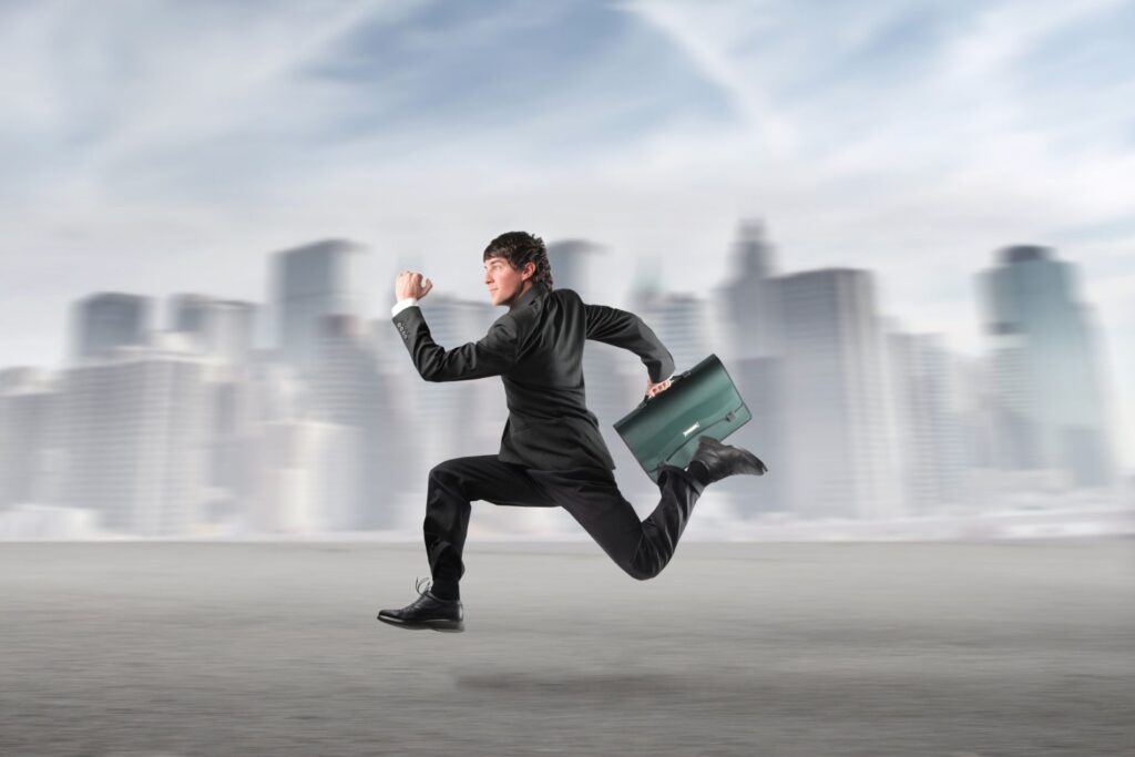 man in a suit with a briefcase, running at speed